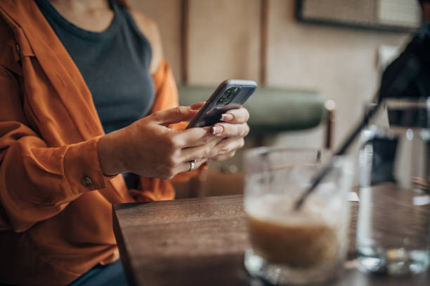 istock Woman sitting in cafe 2110110982