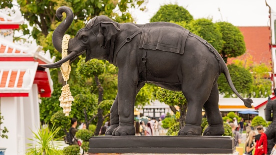 A serene black elephant statue, a symbol of the deep reverence of the Thai people towards these majestic animals, Bangkok, Thailand, October 08th 2023