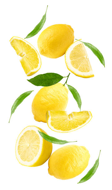 istock flying lemons with slices and green leaves isolated on white background. clipping path 2110119956