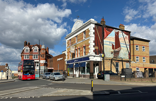 London, Erith, United Kingdom - March 24, 2024: View of the street and the city center with the local pubs and old architecture on a sunny day in Bexel