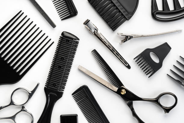 istock Black hairdressing tools and various hairbrushes on white background 2110129904