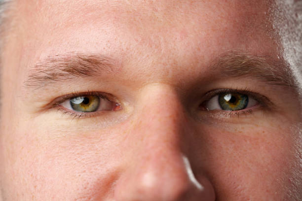 istock Close up shot of a young man face 2110178879