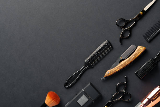 istock An Assortment of Professional Hairdressing Tools Laid Out on a Dark Surface 2110200948