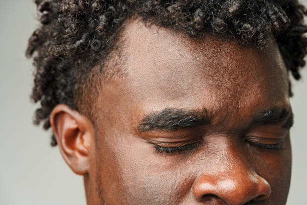 istock Close Up of African Mans Face With Brown Eyes 2110200949