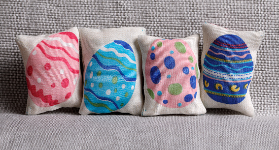 Colorful easter pillows on sofa