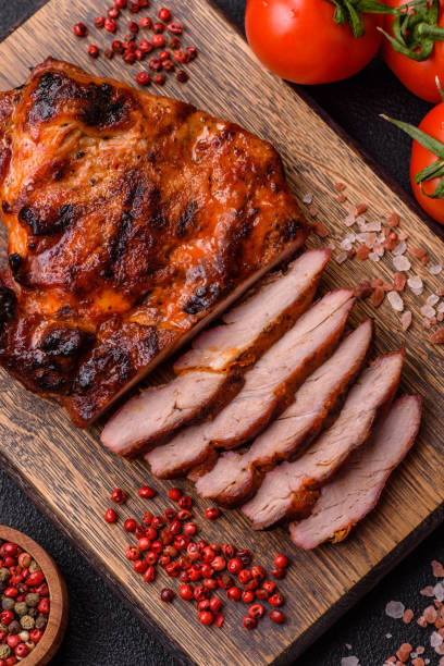 istock Fresh juicy delicious beef steak on a dark background 2110314334
