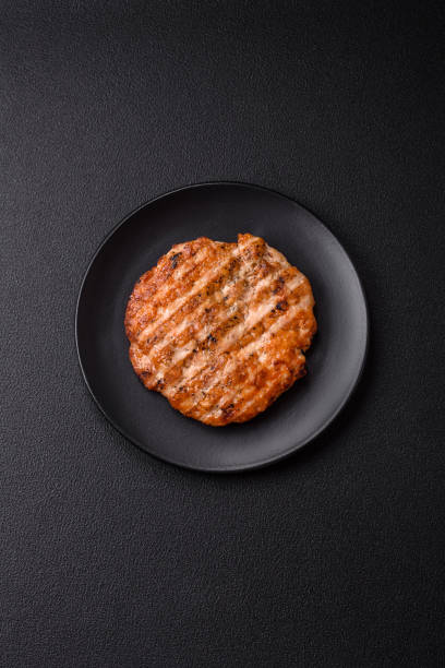 istock Delicious fresh grilled chicken fillet with spices and herbs 2110318008