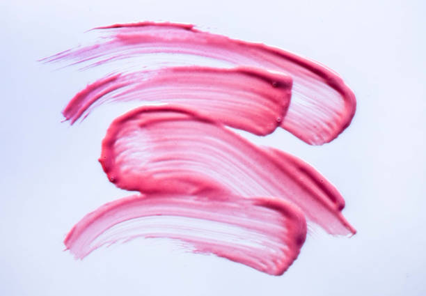 istock Lip gloss palette pink red color smudge sample isolated on gray background 2110322210