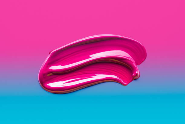 istock Lip gloss pink color smudge sample on blue fuchsia gradient background 2110325309