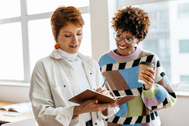 istock Colleagues collaborating in a modern freelance co-working space 2110332479