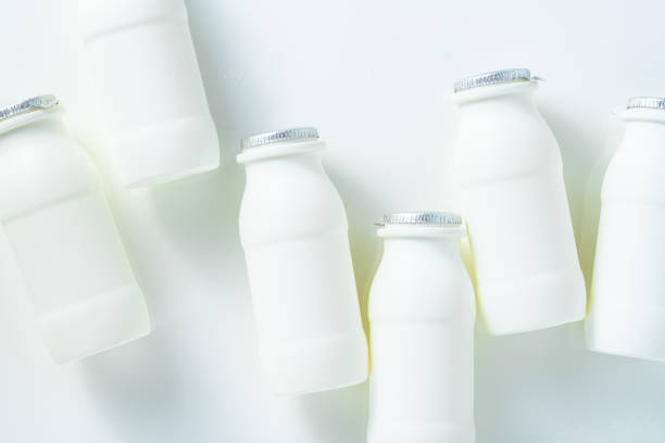 istock drinking yogurt with probiotic in bottles on white 2110355661