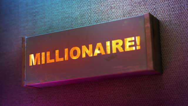 Electronic display showing red light message Millionaire!