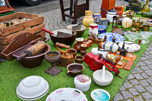 lots of furnishings and pieces of furniture from an antique dealer in the open-air second-hand market