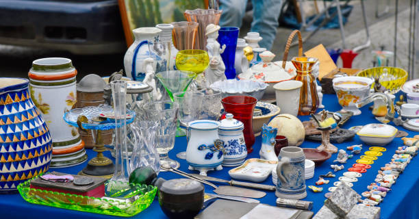 istock Old items on table on garage sell flea market 2110393639