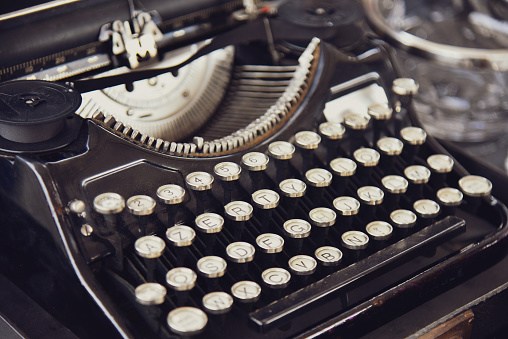 Vintage typewriter. Retro typewriter machine, selective focus.