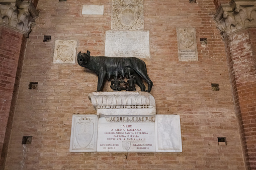 View of She-wolf of Siena (Lupa Senese) with Senio and Ascanio, sons of Remo, founders of the city. Marble statue, symbol of the city of Siena