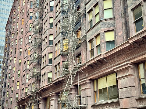 view of the facades of old Chicago buildings in the Lopp district with exterior emergency stairs