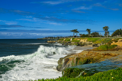 Wide view of ocean waves crashing along the Northern California Coast.\n\nTaken in Santa Cruz, California, USA