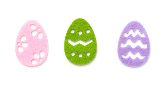 Felt easter eggs isolated on white, top view