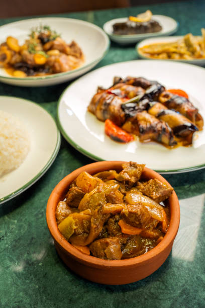 istock Meat dish in casserole in the foreground 2110573854