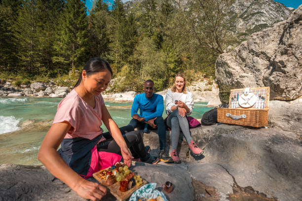 istock Diverse Group Enjoying Outdoor Picnic While Hiking 2110616699