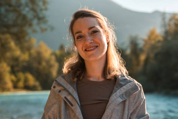istock Smiling Young White Female by The River 2110617811