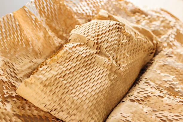 istock Eco friendly brown paper honeycomb wrap for product packaging parcel carton box 2110619503