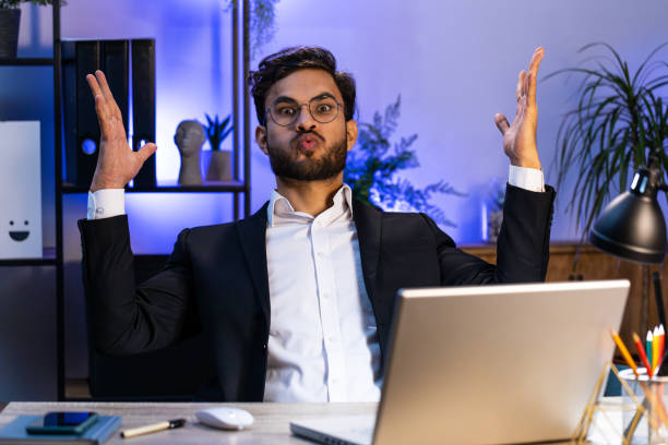 istock Excited amazed Indian businessman looking shocked surprised wow showing head explosion gesture 2110639366
