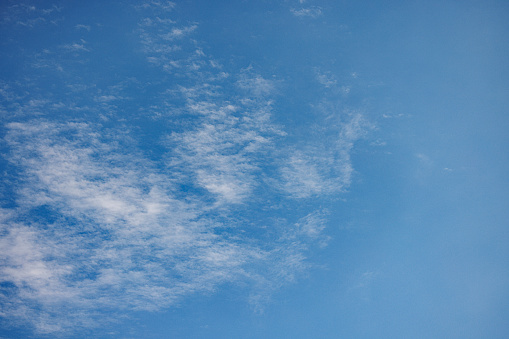 Cloudscape in the bright blue skies over Seattle, Washington USA