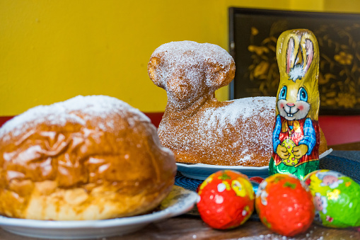 Traditional easter sweet lamb cake with powdered sugar, Bunnie, eggs, baking on old vintage background, Easter Background. High quality photo