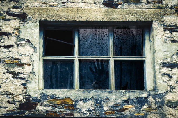 istock Ghostly silhouette behind a window pane. Horror concept. 2110761251