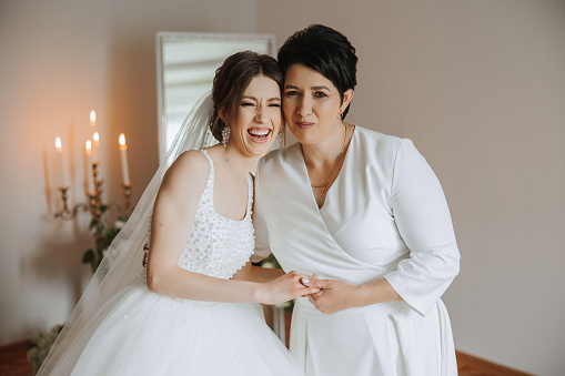 Mother with daughter on wedding day.