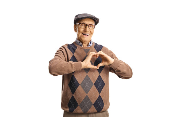 istock Elderly man gesturing a heart symbol 2110770578