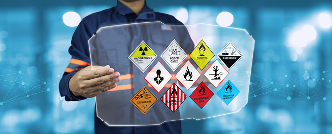 Security staff hold virtual board and inspect the storage of dangerous goods in the warehouse for operator safety such as explosions, radioactive, toxic gases
