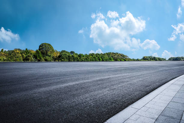 istock Empty asphalt road and woods background. Car road background 2110823198