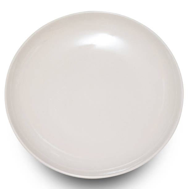istock White circle ceramics plate isolated on white background. 2110824726