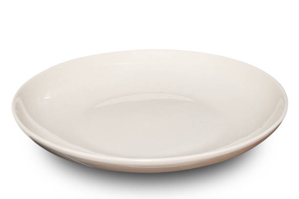 istock White circle ceramics plate isolated on white background. 2110824733