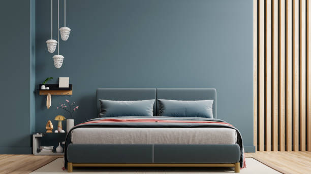 istock Dark bed and mockup dark blue wall in bedroom interior 2110825764