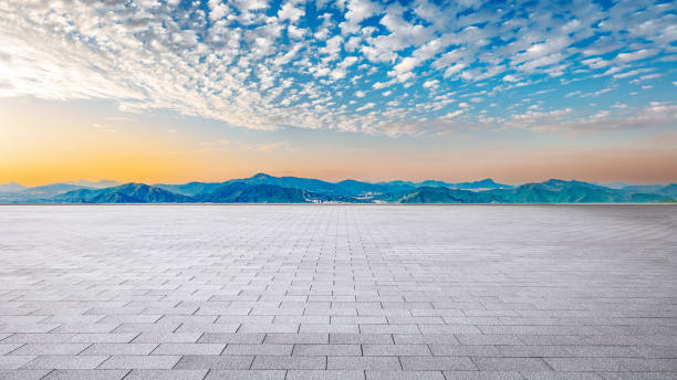 istock Empty square floor and modern city skyline with mountains. Road platform background 2110831521