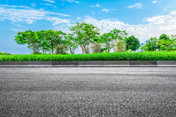 istock Empty asphalt road and woods background. Road platform background 2110836228