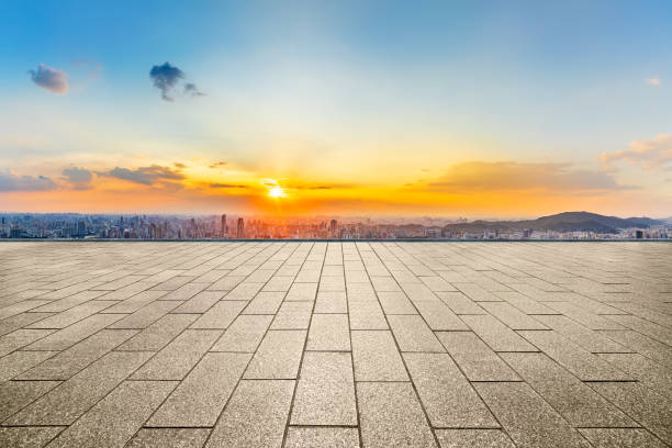 istock Empty square floor and modern city skyline with mountains 2110839933
