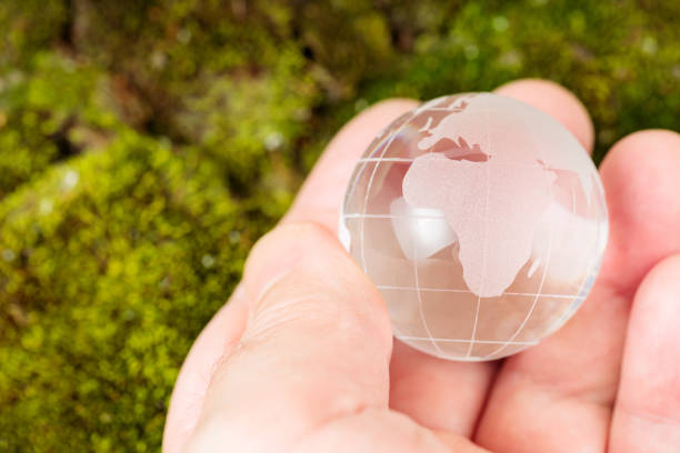 Precious Earth: A shining planet surrounded by lush greenery and blooming flowers - 3D Illustration