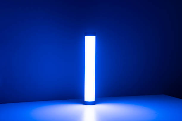 istock A single blue light stick emits a neon glow, creating a tranquil atmosphere in a dimly lit room with vertical blinds. 2110884584
