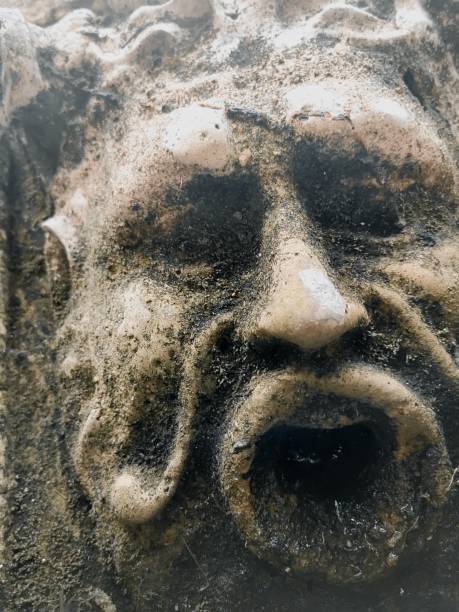 istock Close up of a man face statue in stone. 2110896495