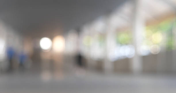 Blurred background bright shopping mall Silver gray lighting. defocused store light bokeh in retail store. Blurry hospital bright softness hotel with copy space. Backdrop present design template.