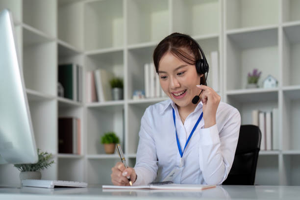 istock Call center friendly woman asian in office for customer service, technical support and advice, contact and communication with employee operator in help desk agency 2110954741