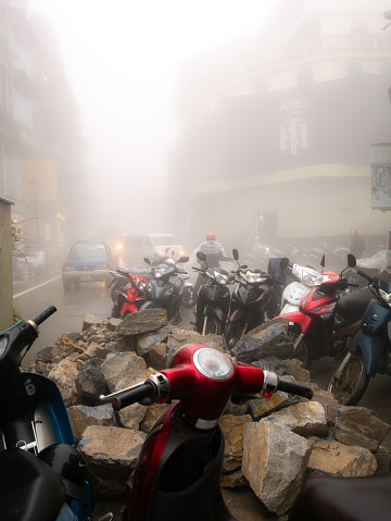 Lao Cai Province Sapa Vietnam : The Motorcycle Parking on The Three Intersections on The Steep Hill Road on a Foggy Day