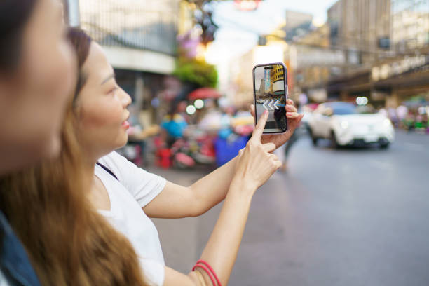 istock Women traveling in Chinatown. 2111014130
