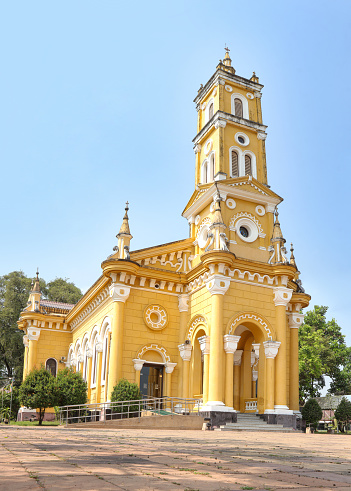 Saint Joseph Catholic Church, Ayutthaya Thailand. Bright yellow Catholic church on the river banks of the Chao Phraya river.