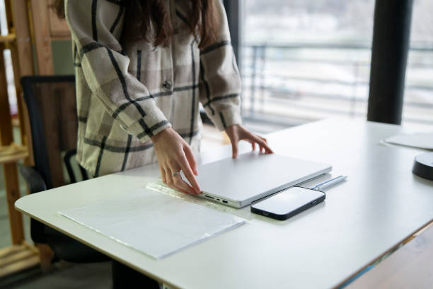 istock Organizing Desk Space With Laptop, Notebook, and Smartphone in Modern Office 2111071016